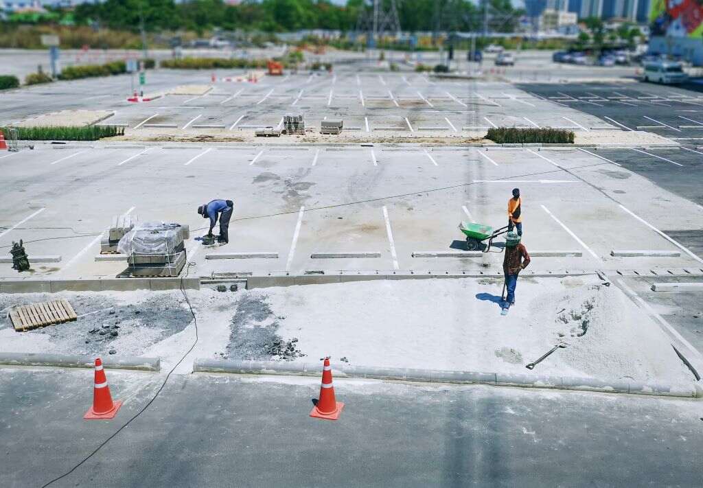 men-working-parking-lot